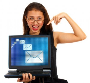 Smiling Girl Pointing To Notebook Computer Screen - For Adding Own Message