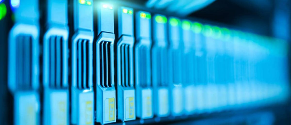 Glowing server rack filled with hard drives