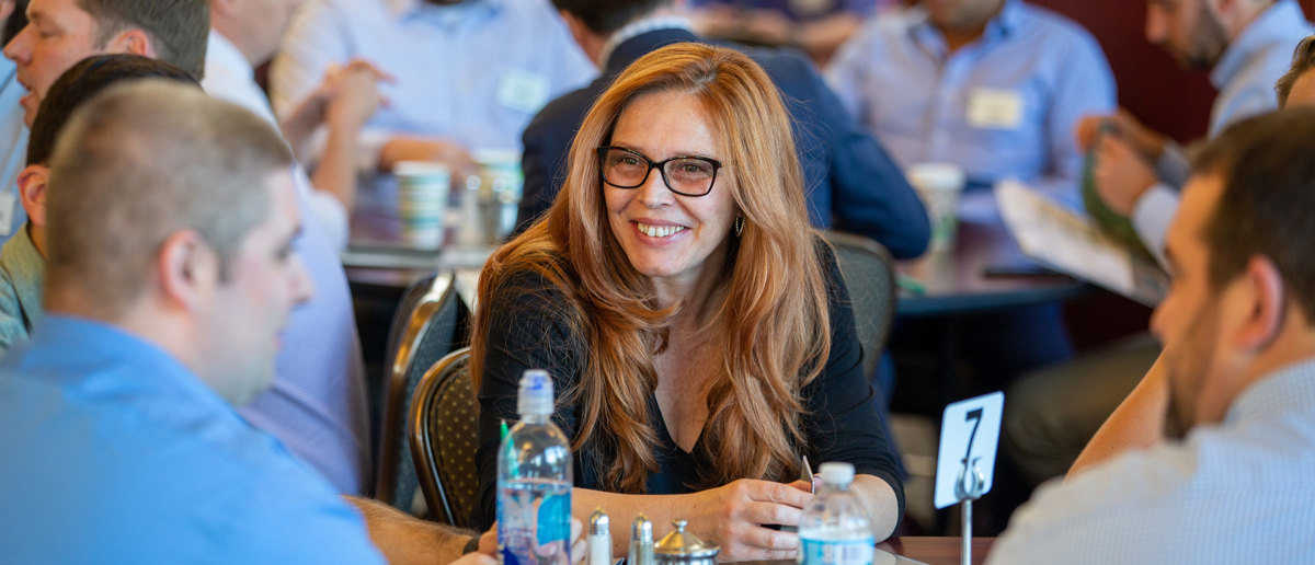 Executive MBA students engage at their program orientation.