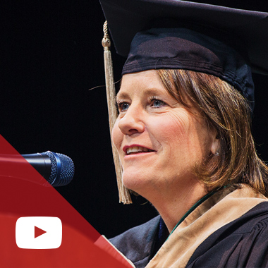Lina Hubbard wears her commencement ceremony robes and cap