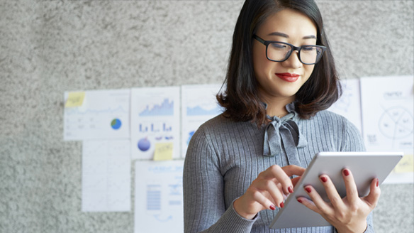 A woman uses an iPad