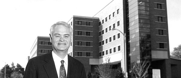 James Henry in front of the Business College Complex