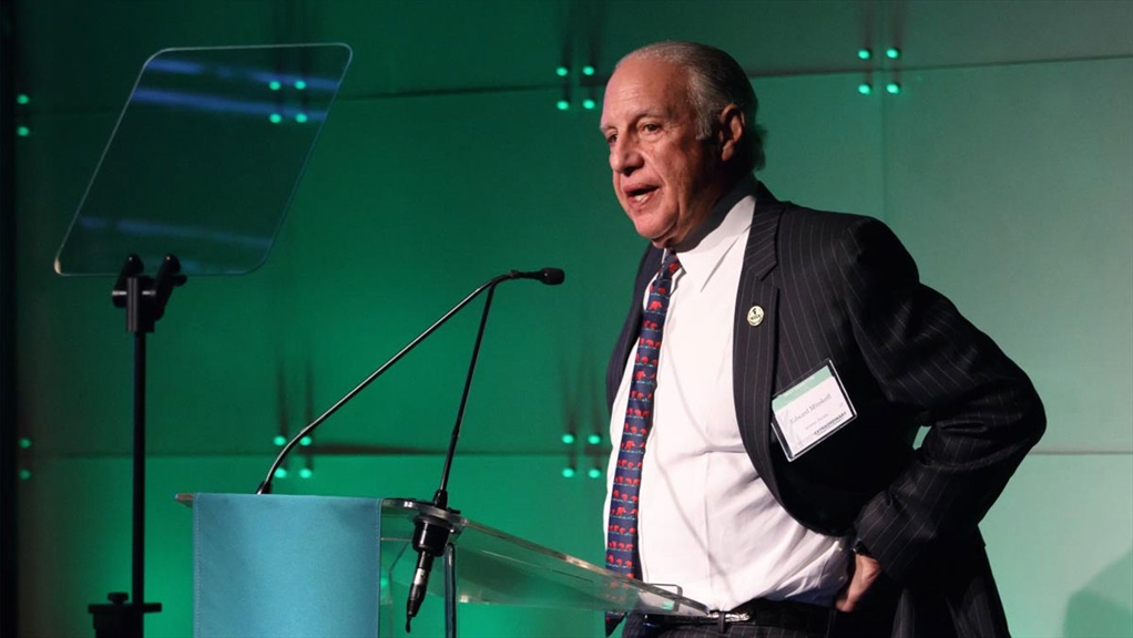 Edward J. Minskoff speaks at a podium